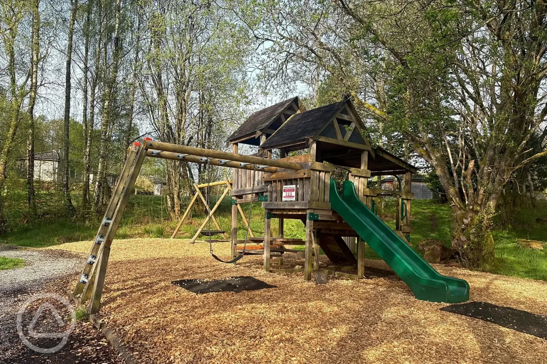 Children's climbing play area with a slide Children's climbing play area with a slide