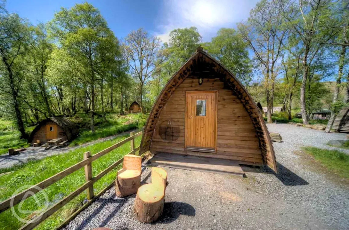 Dog friendly camping pods within a woodland setting Dog friendly camping pods within a woodland setting