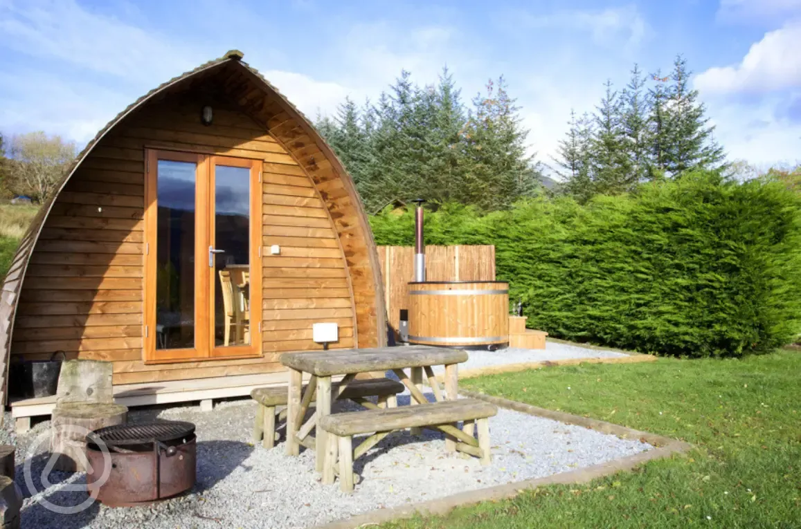Premium ensuite glamping pod with private wood-fired hot tubs and picnic bench Premium ensuite glamping pod with private wood-fired hot tubs and picnic bench