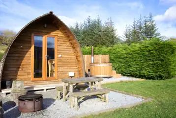 Premium ensuite glamping pod with private wood-fired hot tubs and picnic bench Premium ensuite glamping pod with private wood-fired hot tubs and picnic bench