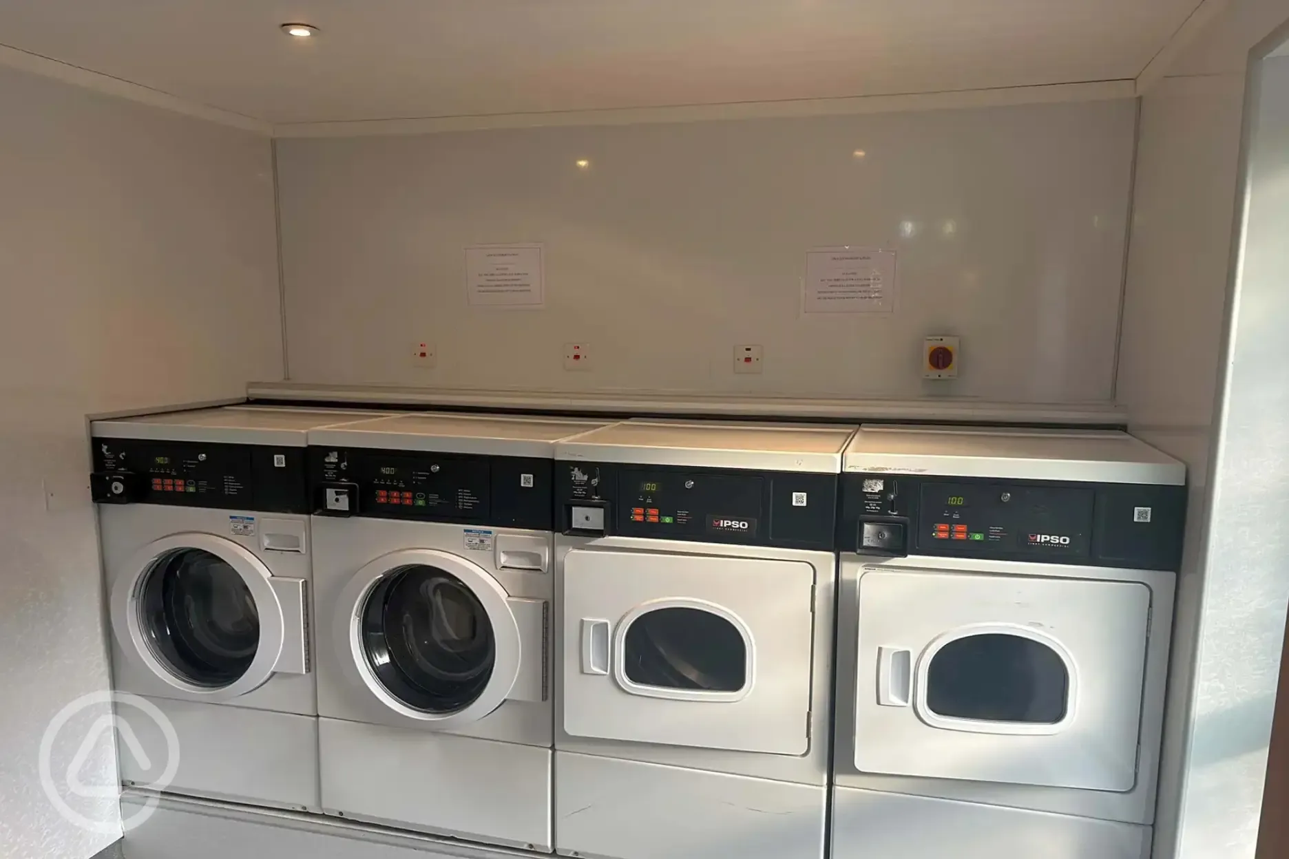 Launderette with washing machines and dryers Launderette with washing machines and dryers