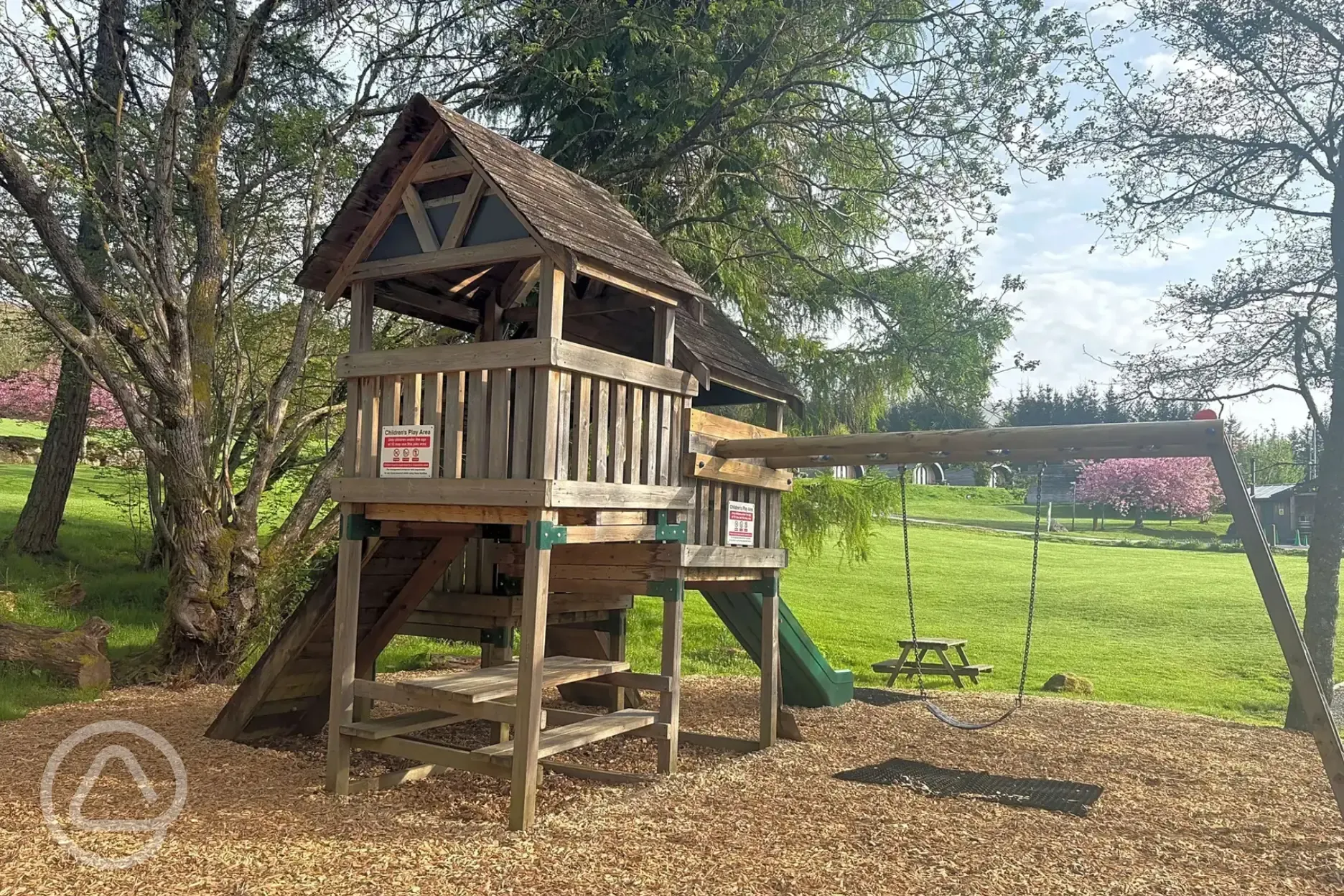 Children's play area with a swing Children's play area with a swing