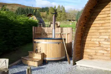 Premium ensuite glamping pod with a private wood fired hot tubs Premium ensuite glamping pod with a private wood fired hot tubs
