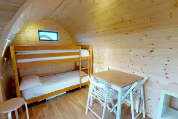 Orchard pod interior with bunk beds (bring own bedding) Orchard pod interior with bunk beds (bring own bedding)