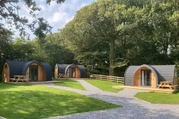 Orchard camping pods with picnic benches
