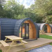 Orchard pods with small decking areas and picnic benches Orchard pods with small decking areas and picnic benches