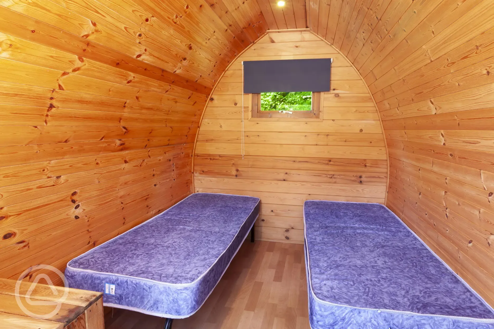Camping pod featuring two camp beds (no bedding included)
