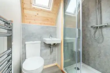 Large gold glamping pod ensuite with toilet and shower Large gold glamping pod ensuite with toilet and shower