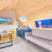 Gold glamping pod, sleeping two with a double bed and luxury interior