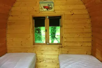 Camping pod interior with two single beds (bring own bedding and linen)