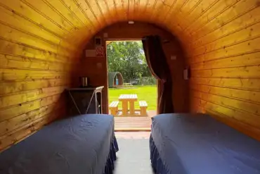 Camping pod interior with two single beds (bring own bedding and linen)