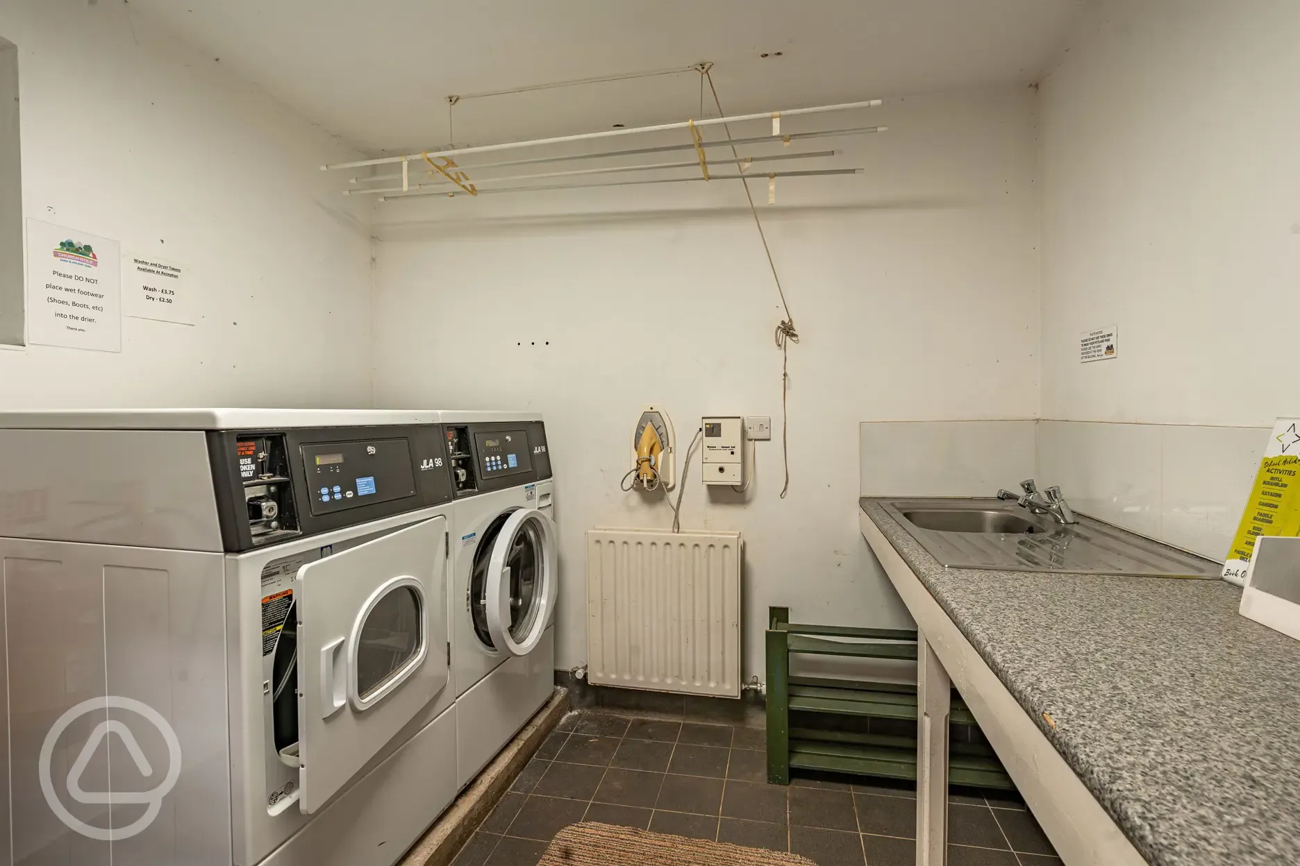 Laundry with token operated machines (buy tokens at the office)