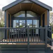 Ensuite glamping cabin with decking area and seating Ensuite glamping cabin with decking area and seating