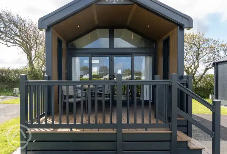 Ensuite glamping cabin with decking area and seating