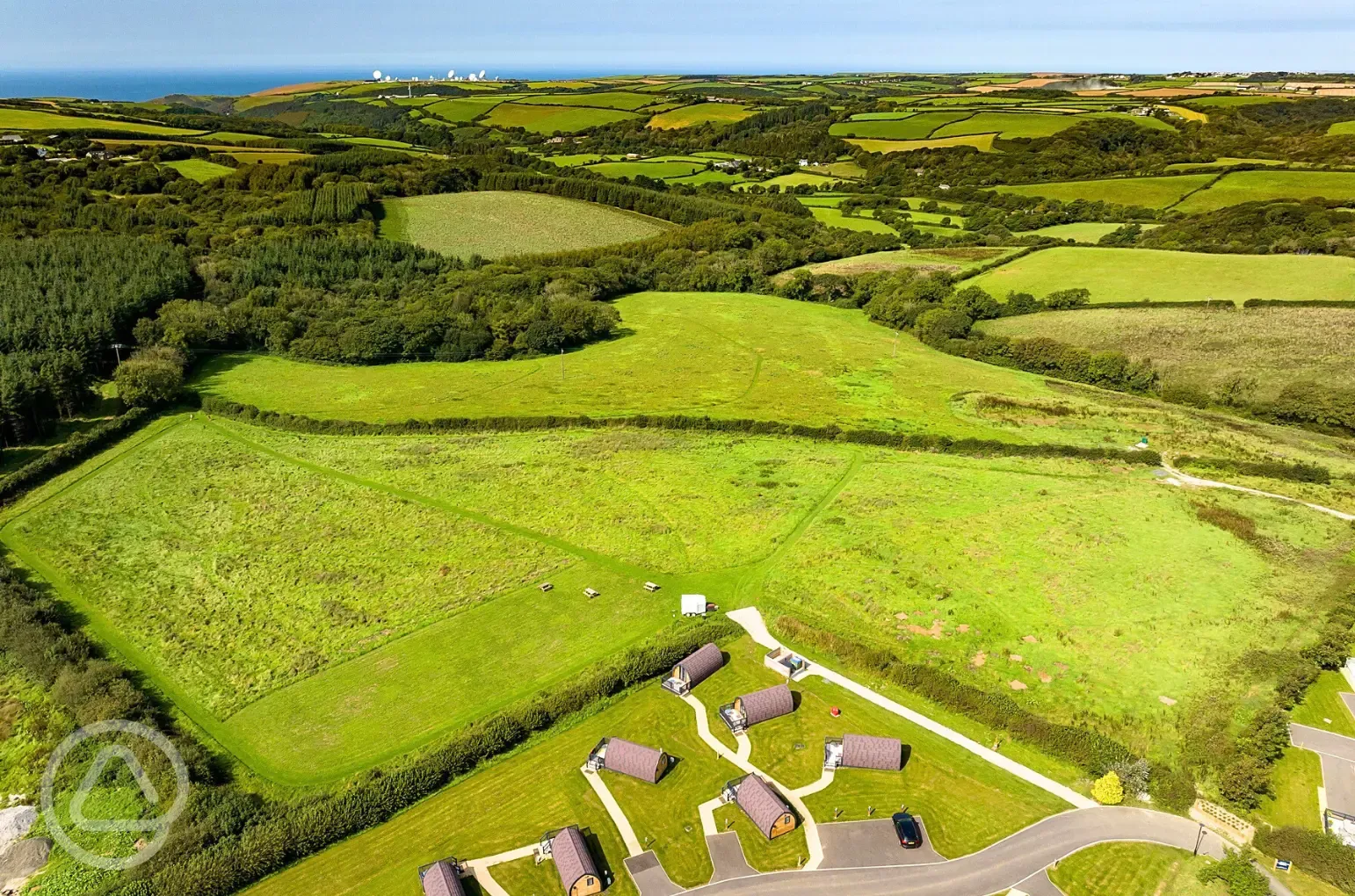 Aerial of the glamping pods and countryside
