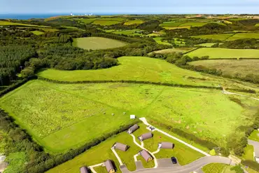 Aerial of the glamping pods and countryside