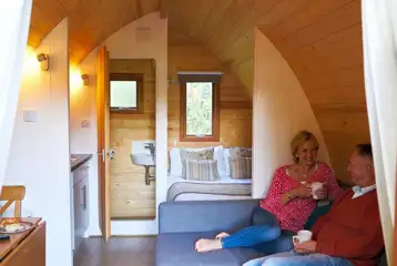 Mega pod with a double bed, double sofa bed, kitchenette and ensuite toilet
