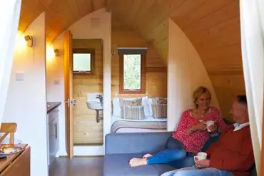 Mega pod with a double bed, double sofa bed, kitchenette and ensuite toilet