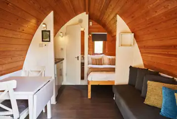 Mega pod with a double bed, double sofa bed, kitchenette and ensuite toilet