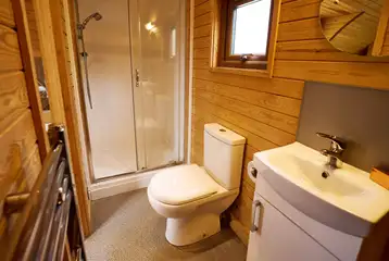 Ensuite toilet, shower, and handwashing sink in the deluxe mega glamping pod Ensuite toilet, shower, and handwashing sink in the deluxe mega glamping pod