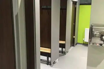 Showers with space for getting changed and benches