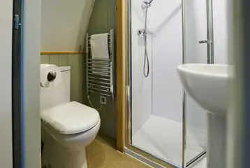 Ensuite toilet, shower, and handwashing sinks in the premier glamping pods Ensuite toilet, shower, and handwashing sinks in the premier glamping pods