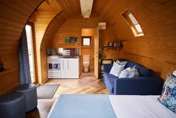 Deluxe mega pod with a small kitchenette, a double sofa bed, and double bed Deluxe mega pod with a small kitchenette, a double sofa bed, and double bed