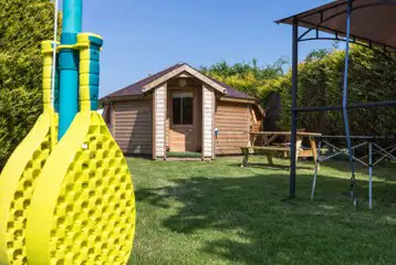 Glamping cabin with swing ball and outdoor covered area Glamping cabin with swing ball and outdoor covered area