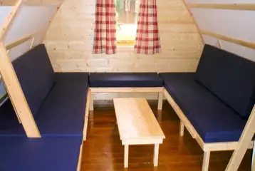 Wooden camping pod beds with memory foam mattresses that become seating Wooden camping pod beds with memory foam mattresses that become seating