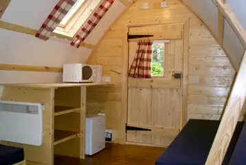 Wooden camping pod with a fridge, kettle and microwave Wooden camping pod with a fridge, kettle and microwave