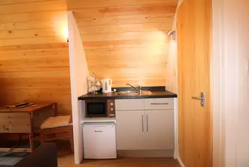 Ensuite glamping pod kitchen with a fridge, kitchen sink, kettle, microwave Ensuite glamping pod kitchen with a fridge, kitchen sink, kettle, microwave