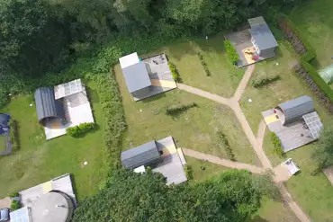 Aerial of the glamping units at Back of Beyond Touring Park