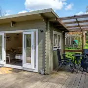 Lodge pods with a covered deck area and furniture