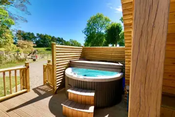 Ensuite glamping pod with hot tub and private decking area Ensuite glamping pod with hot tub and private decking area