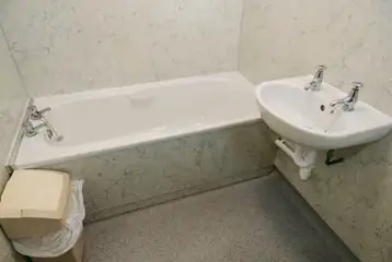 Bathroom with sink and bath