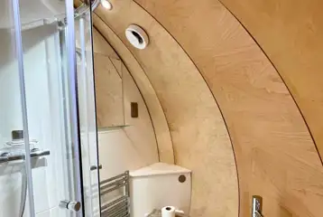 Super glamping pod ensuite with a toilet, sink and shower