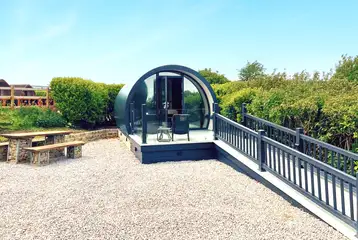 Super glamping pod with ramp access and a glass front