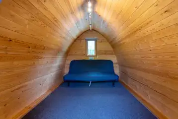 Double sofa bed in the large camping pod (please bring your own bedding) Double sofa bed in the large camping pod (please bring your own bedding)