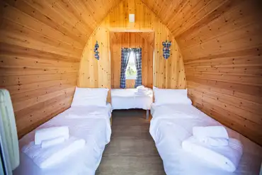 Camping pods with a double and two single beds (bring own bedding)