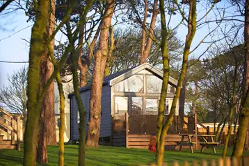 Skylight glamping cabins with glass fronts and decking areas Skylight glamping cabins with glass fronts and decking areas