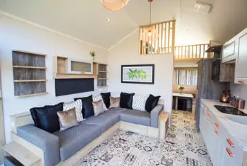 Skylight open-plan interior with a sofa bed, kitchen and mezzanine area Skylight open-plan interior with a sofa bed, kitchen and mezzanine area