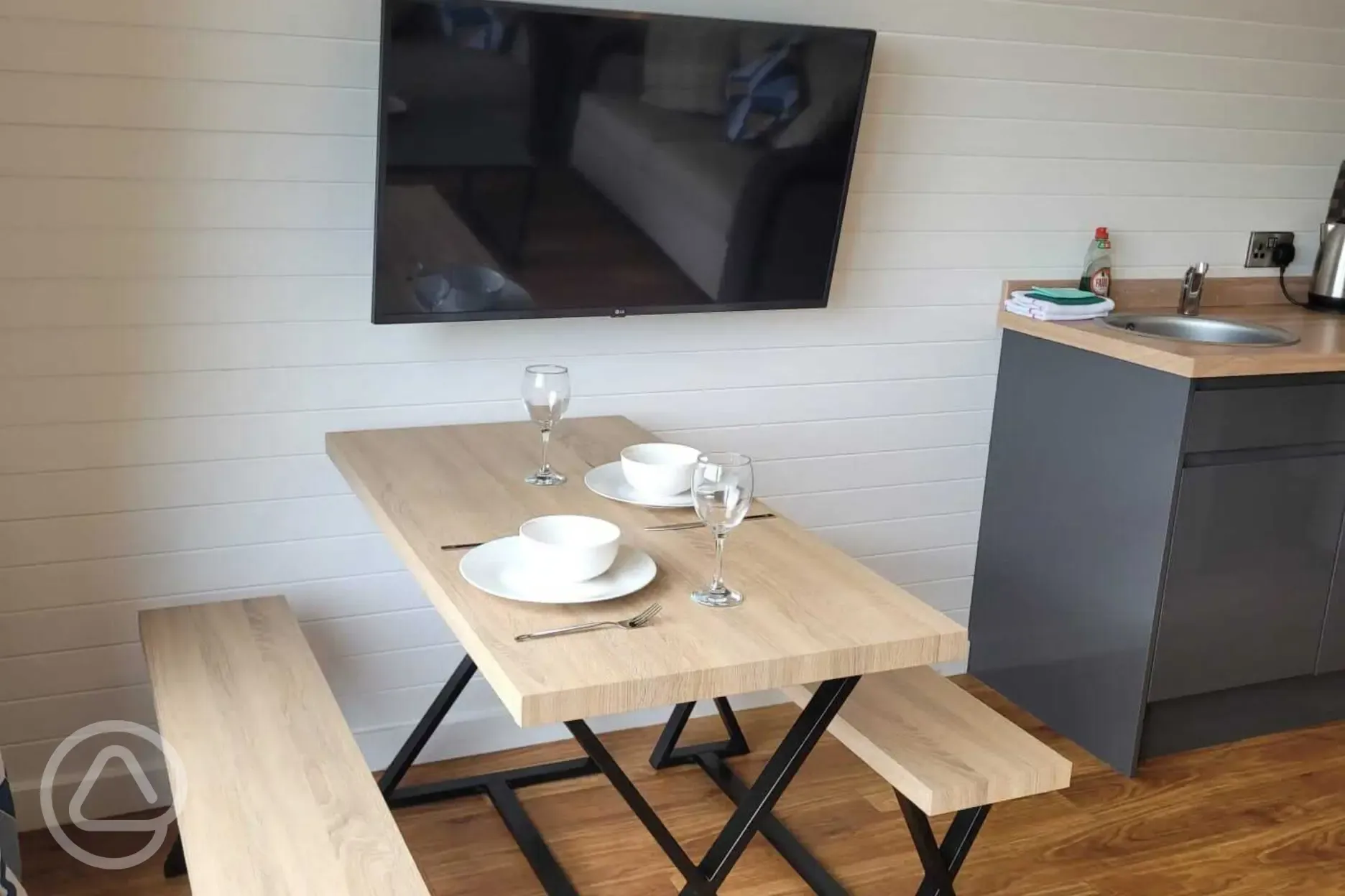 Gwel yr Bae large glamping pod dining table and TV (pet friendly)