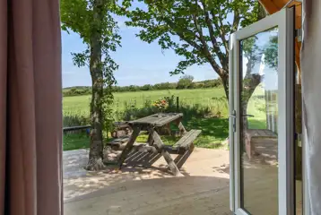 Pod private decking with a picnic bench Pod private decking with a picnic bench