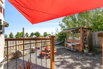 Y Caban garden area with a fire pit, picnic bench and kitchen hut Y Caban garden area with a fire pit, picnic bench and kitchen hut