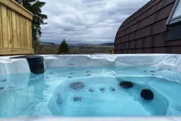 Executive glamping pod with hot tub