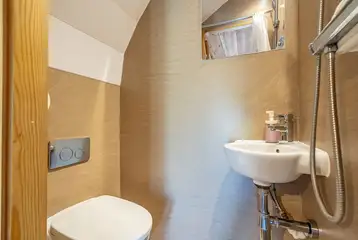 Four person glamping pod wet room with a toilet and shower Four person glamping pod wet room with a toilet and shower