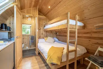Five person glamping pods with a double bed, single bunk and double sofa bed Five person glamping pods with a double bed, single bunk and double sofa bed