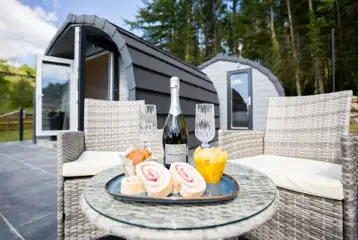 Luxury ensuite glamping pod outdoor seating area