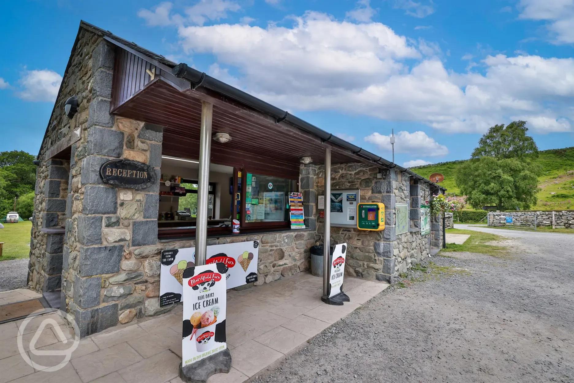 Site reception and shop selling ice cream, drinks and camping equipment