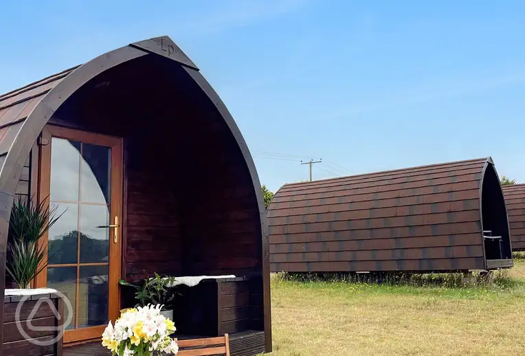Glamping pods exterior with outdoor seating
